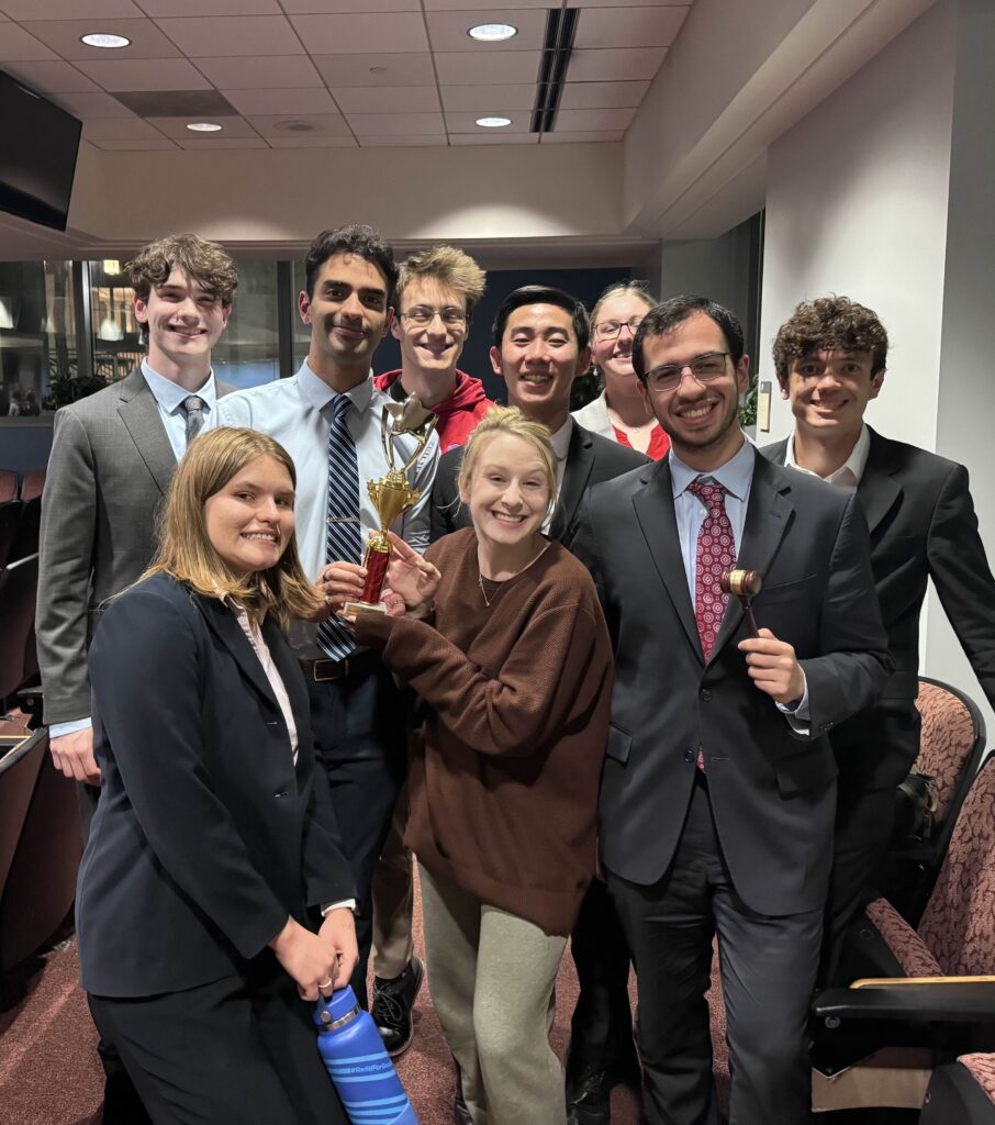 Team photo after Haverford College's tournament, with members holding trophies